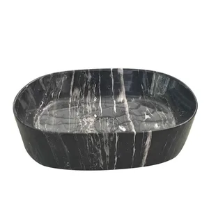 כיור מונח אובלי בשחור שיש